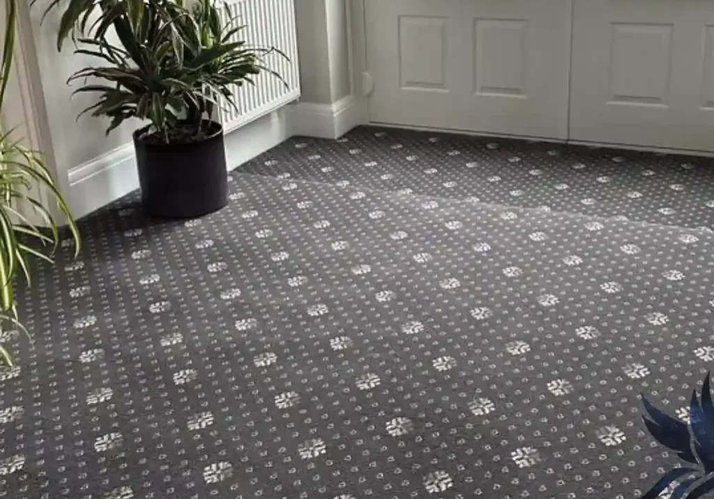 Grey carpet with white floral pattern.